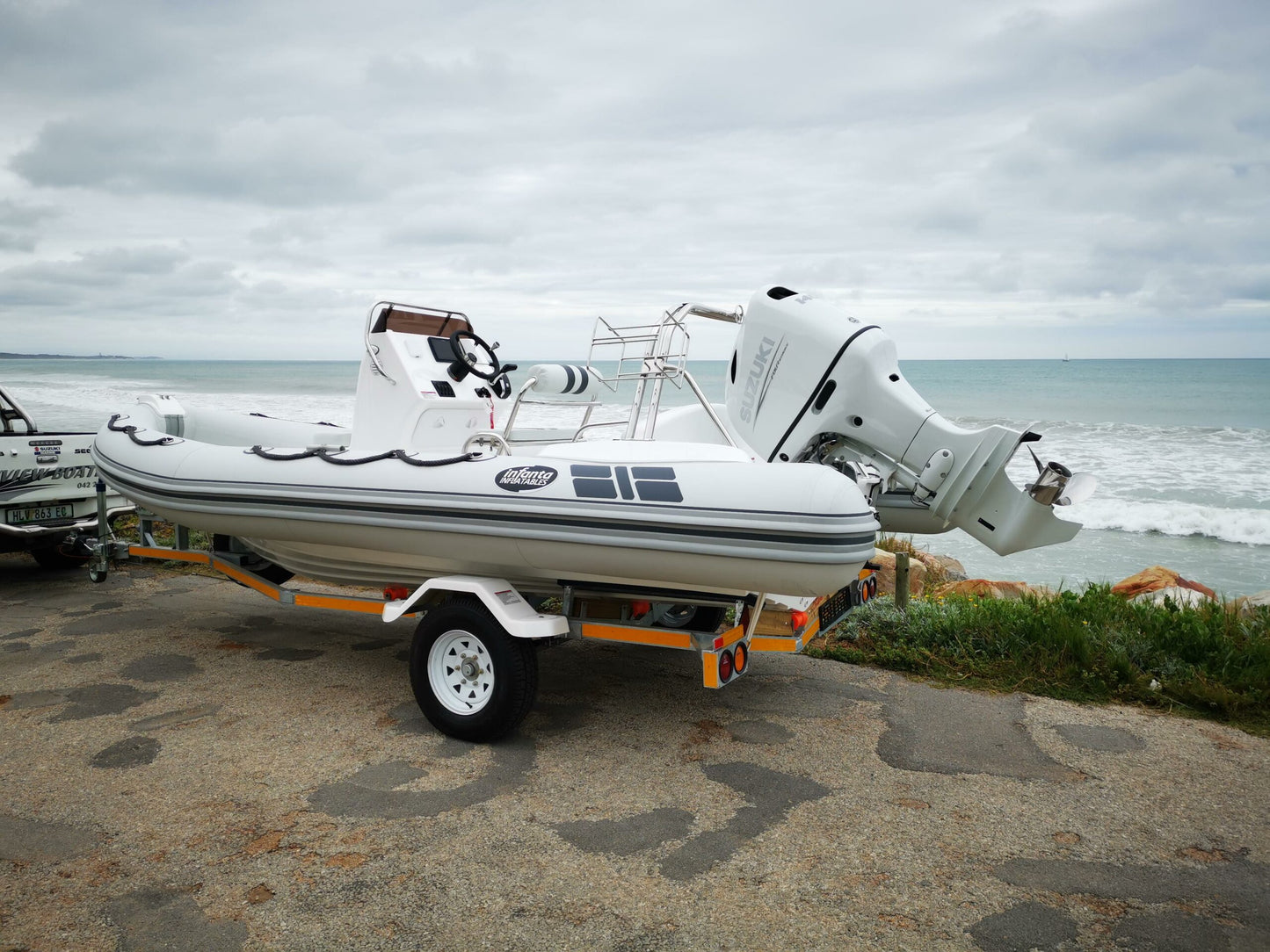 NEW INFANTA 5.8 WITH A 2022 COOL WHITE DRIVE-BY-WIRE 140HP SUZUKI