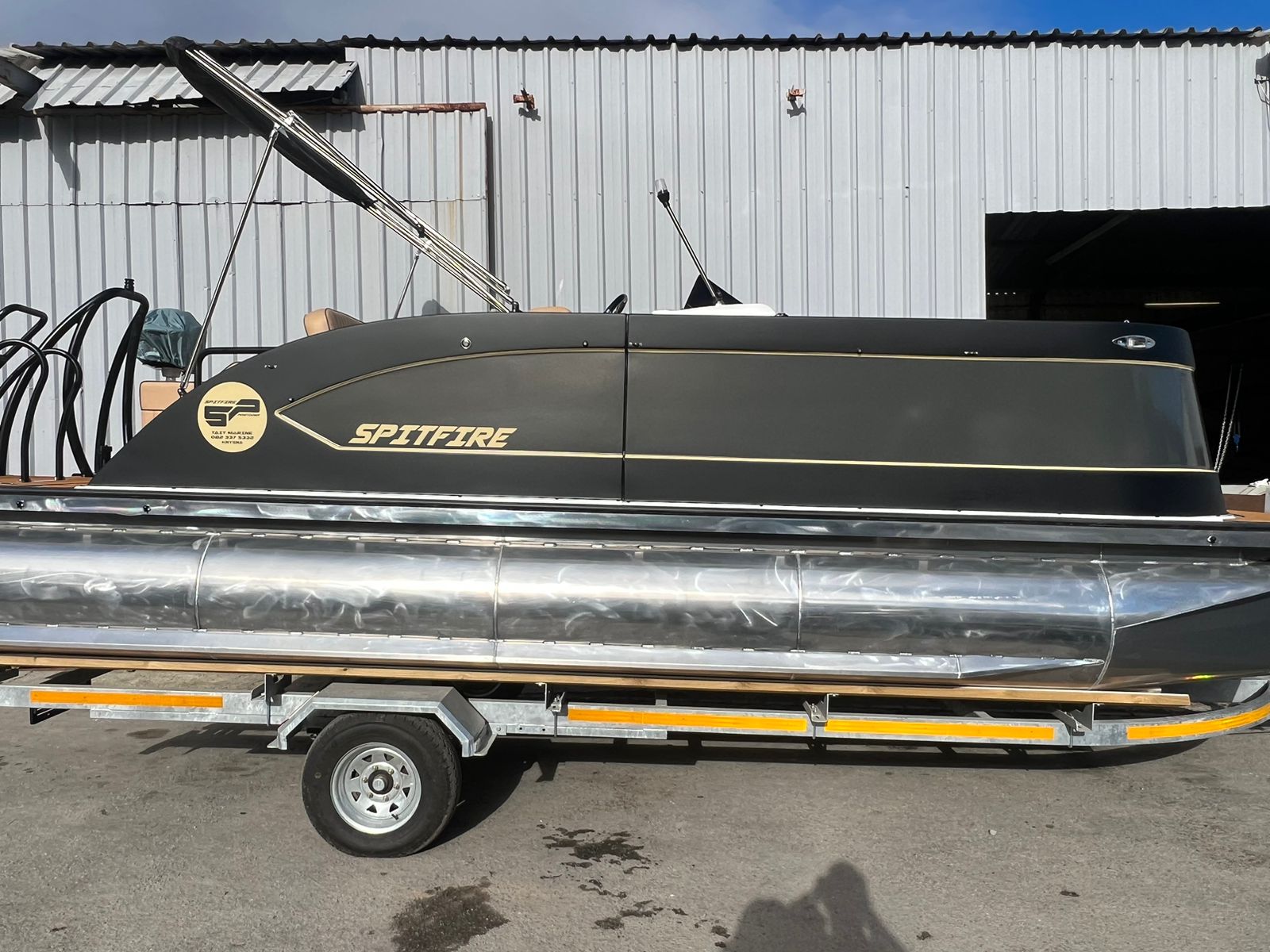 Spitfire 6250 pontoon boat in Cool White with Suzuki 140HP engine