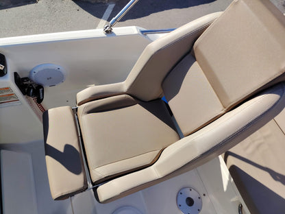 Beige cushioned seat on a boat with a white interior