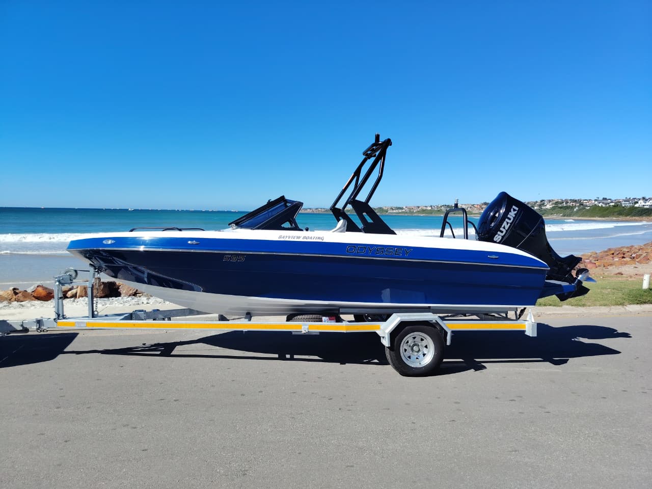 Odyssey 595 boat with Suzuki 200HP outboard on water