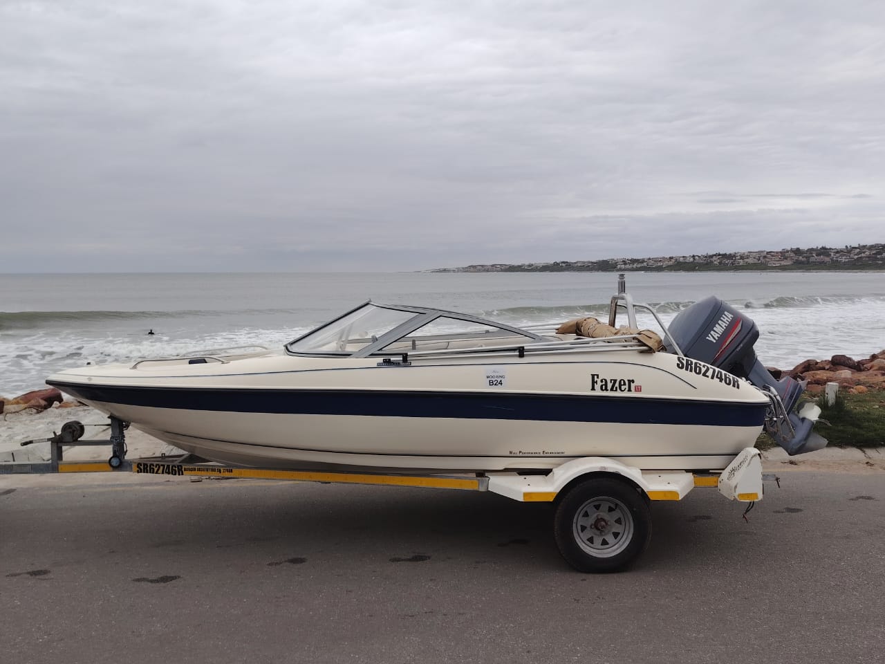 Fazer ski boat with Yamaha 115HP outboard on trailer