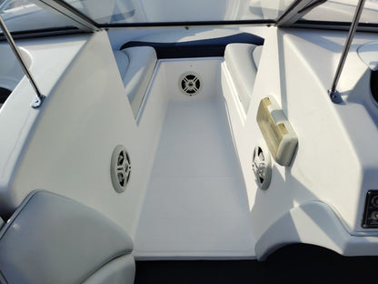 Blue and white Kestrel 575 boat with a Yamaha 150HP four-stroke outboard and trailer.